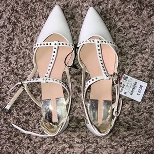 White flats with gold studs